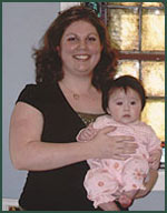 Libby holds Olivia during a recent visit to our office.