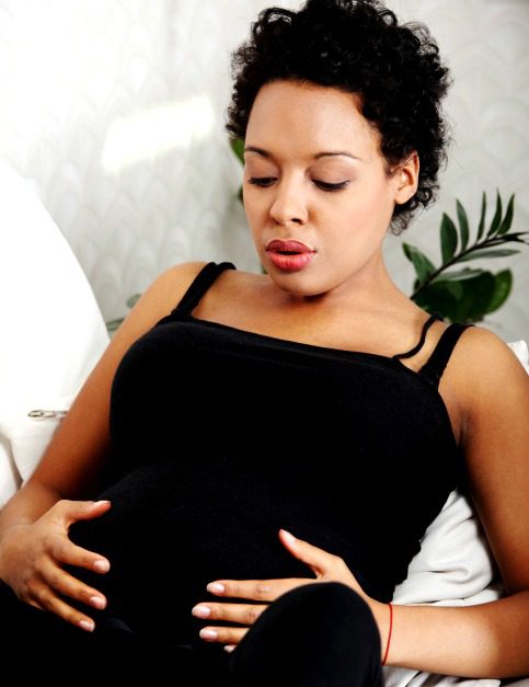 pregnant woman doing breathing exercises