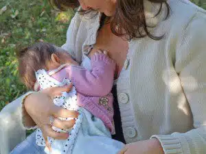 woman breastfeeding her baby