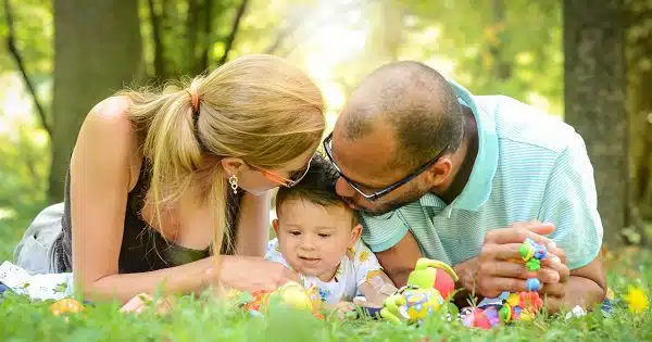 family relaxing on the lawn