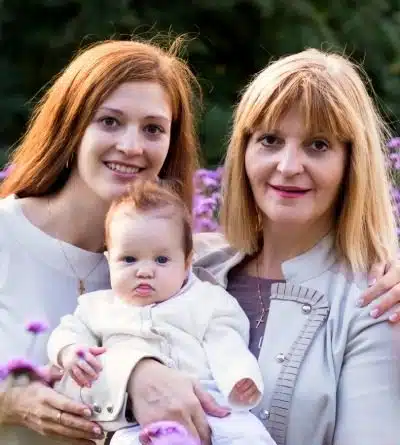 Mom with her adoptive adult daughter and adopted granddaughter 