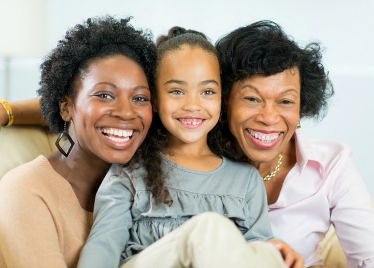 Portrait of a adoptive grandmother, birth mom and granddaughter