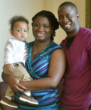 African American adoptive couple with their infant son