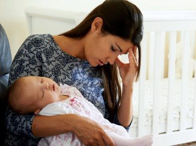 Young mother struggling with her baby, why women choose adoption