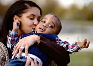 Lifetime adoptive mother Kimberly embraces her son