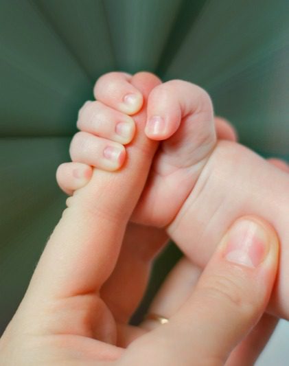 infant_holding_dads_finger.jpg