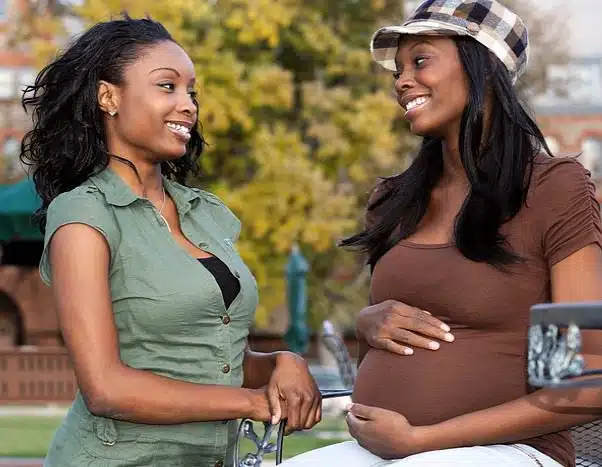 Two women talking at a park