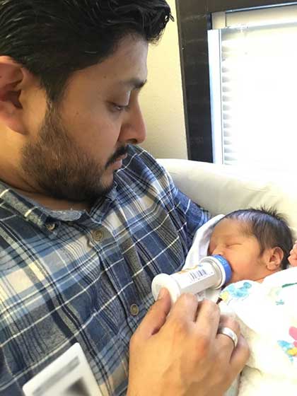 Adoptive father feeds newly adopted baby, they didn't have to wait long for their adoption