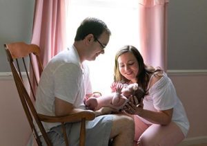 adoptive family with newborn baby