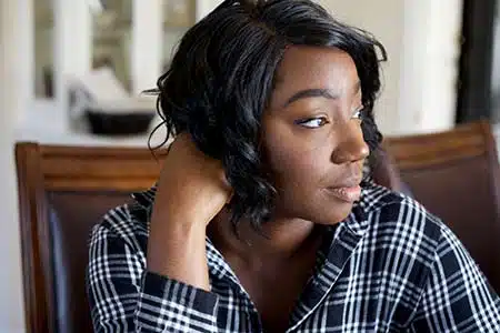 African American woman experiencing birthmother grief