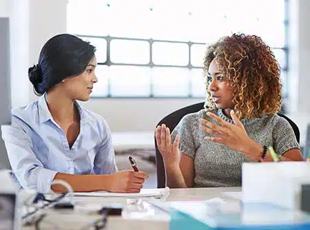 women talk together about making an adoption plan