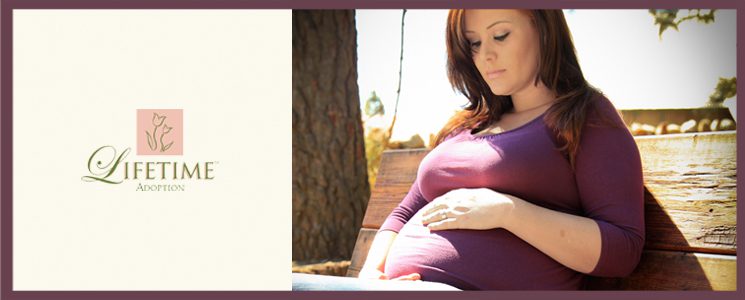 pregnant woman looking at her belly and telling her adoption story