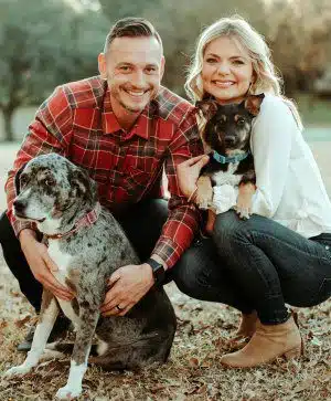 Geoff and Jordan pose with their friendly dogs