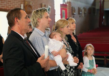 Adoptive family and birth parents at an adoption entrustment ceremony