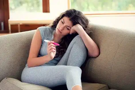 pregnant woman with pregnancy test