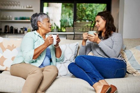 Woman having a chat with her mother over coffee