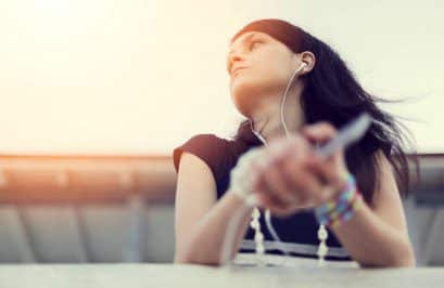 girl listening to her music while thinking about choosing adoption