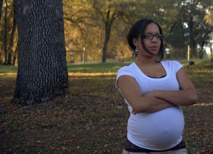 pregnant woman thinking about adoption
