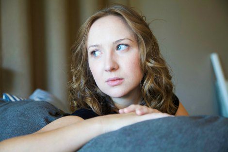 Women sitting on couch after learning about pregnancy