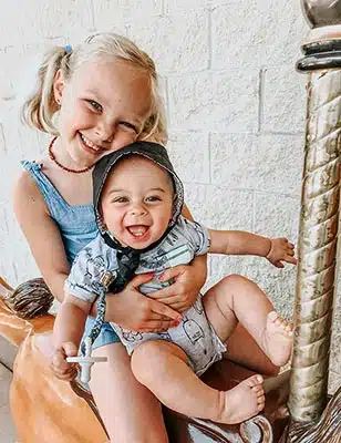 Two children who were adopted by the same couple at Lifetime