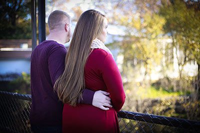 Grieving couple pause on a trail walk