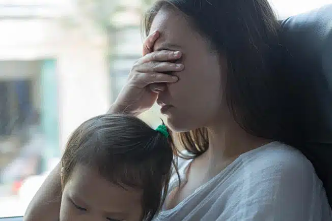 woman with child wondering about how to put a child up for adoption