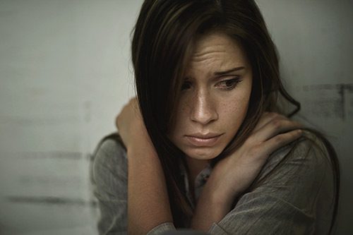 Young woman, depressed after being forced to place her baby in a closed adoption