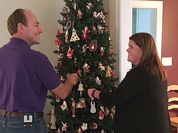Hopeful adoptive parents Bryan and Michele decorate their Christmas tree