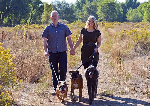 Hopeful adoptive parents Cody and Ashley enjoying a walk together with their dogs