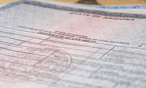 Close-up photo of an Arizona birth certificate, to answer the question what does an adopted birth certificate look like?