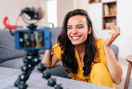 Young beautiful woman recording content for her vlog