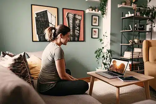 A birth mother video chats with her daughter and the adoptive mother