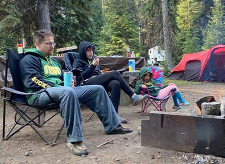 Matt and Nikki on a camping trip with their daughter