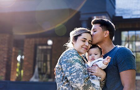 Happy family who took advantage of all military adoption benefits available