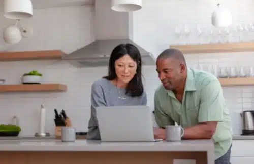 Hopeful adoptive parents prepare for their adoption on the kitchen counter