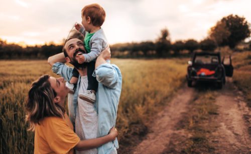 Young couple spend time outdoors with baby boy after they turned from infertility to adoption