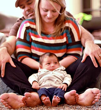 Orlando Adoptive family holding their adopted newborn baby