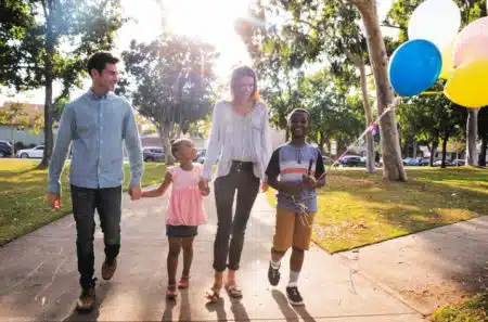 appy family with children celebrating at the park 