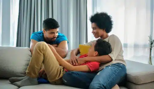 Side view of African American parents following tips to prepare your child for an adopted sibling