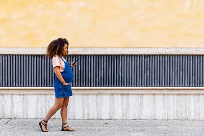 pregnant woman walking down street in Columbus Ohio