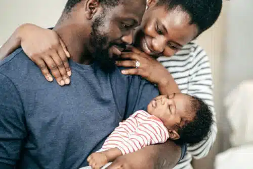 Happy new adoptive parents who had asked Can you name an adopted child?