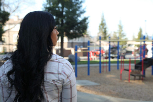 A woman at a playground thinks about her life after adoption