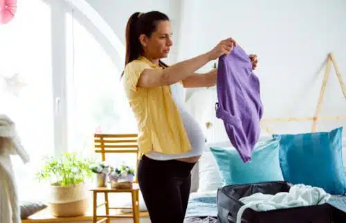 Pregnant woman packing her hospital bag