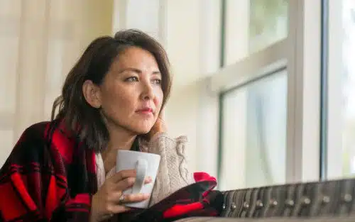 Hopeful adoptive mom looking out the window