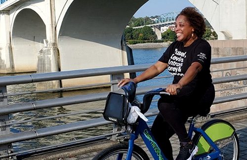 Hopeful adoptive mother Aishah enjoying a bike ride by the river