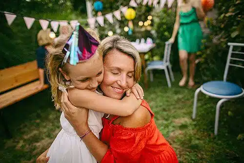 A happy birth parent celebrates her daughter's birthday