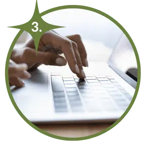 woman typing on laptop how to start the adoption process 3