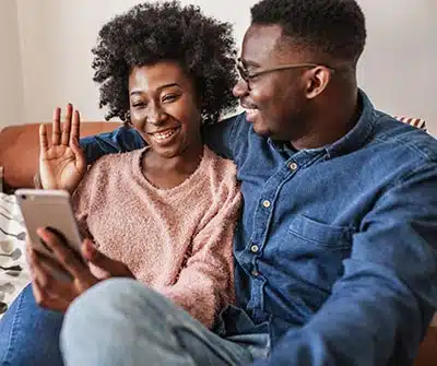 couple waving at camera