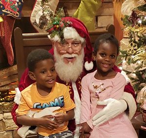 Chris and Amanda's children pose with Santa