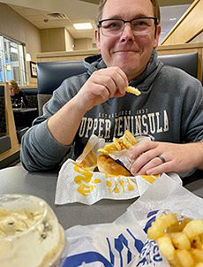 Cody enjoying a meal from the fast-food chain Culvers